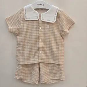 [아가방]노아체크반팔5부오픈상하 01T323018_US