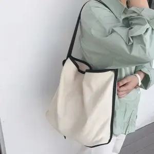 끈조절 파우치 내장 캔버스 소재 크로스 숄더백