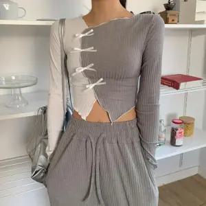 [옷자락]여자 라운드넥 하이브 리본 프릴 사선 골지티