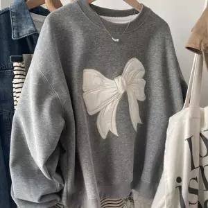 [아리엘스타일]리본포인트 루즈핏 이지코지룩 왓썹리본맨투맨