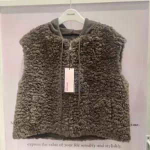 무자크 HC06 니트후드뽀글이조끼 9 MQ1WLT03 1179875