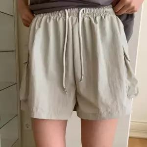 [신세계라이브쇼핑][옷자락] 여자 허리밴딩 리본자수 포켓 카고 반바지