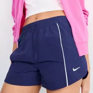 나이키 미드라이즈 우븐 쇼츠팬츠_C FV7501-410