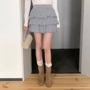 [하프클럽/]여성용 사계절 울혼합 펀칭 디자인 캉캉 니트 미니스커트