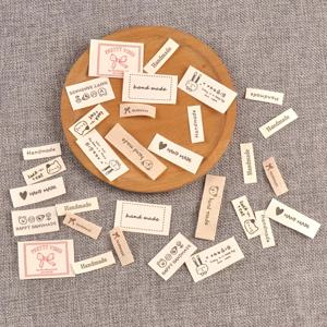 TEMU 하트, 리본, 고양이 디자인의 베이지색 패브릭 라벨 50개 랜덤 혼합. 가방, 모자, 스카프, 의류 제작 프로젝트에 적합하며, 1.5-5cm 크기이며, 접착식 뒷면 없이 수동으로 재봉해야 합니다.