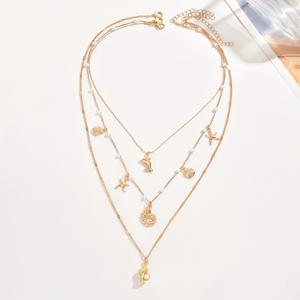 TEMU 스타프시, 호록, 돌고래를 포함한 바다 테마 펜던트 3종 세트가 돋보이는 스타일리시한 골드 목걸이. 여름 해변 휴가에 완벽합니다. 이 핸드메이드 제품은 일상 사용 및 여행용으로 디자인되었습니다.