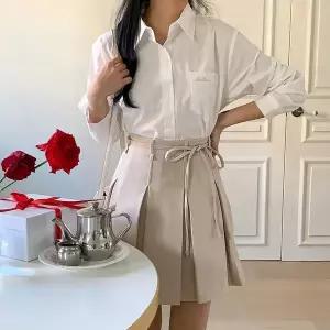 [하프클럽/]여성 리본 장식 플리츠 미니 스커트 허리 스트랩