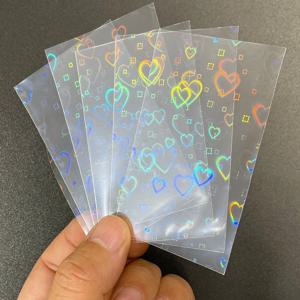50PCS 58x87mm 레이저 별 하트 무지개 나비 게임 아이돌 카드 보호기 홀로그램 클리어 카드 필름 슬리브 커버