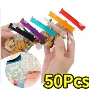 050PCS 미니 알약 디스펜서 가방 슬라이딩 지퍼가 달린 Protable 여행용 보석 주머니 자체 밀봉 방수 보관