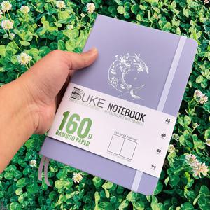 TEMU BUJO의 160Gsm 두께의 두꺼운 종이와 도트 그리드 디자인을 특징으로 하는 A5 사이즈의 불릿 저널 1개. 라이트 퍼플 PU 가죽 하드커버.