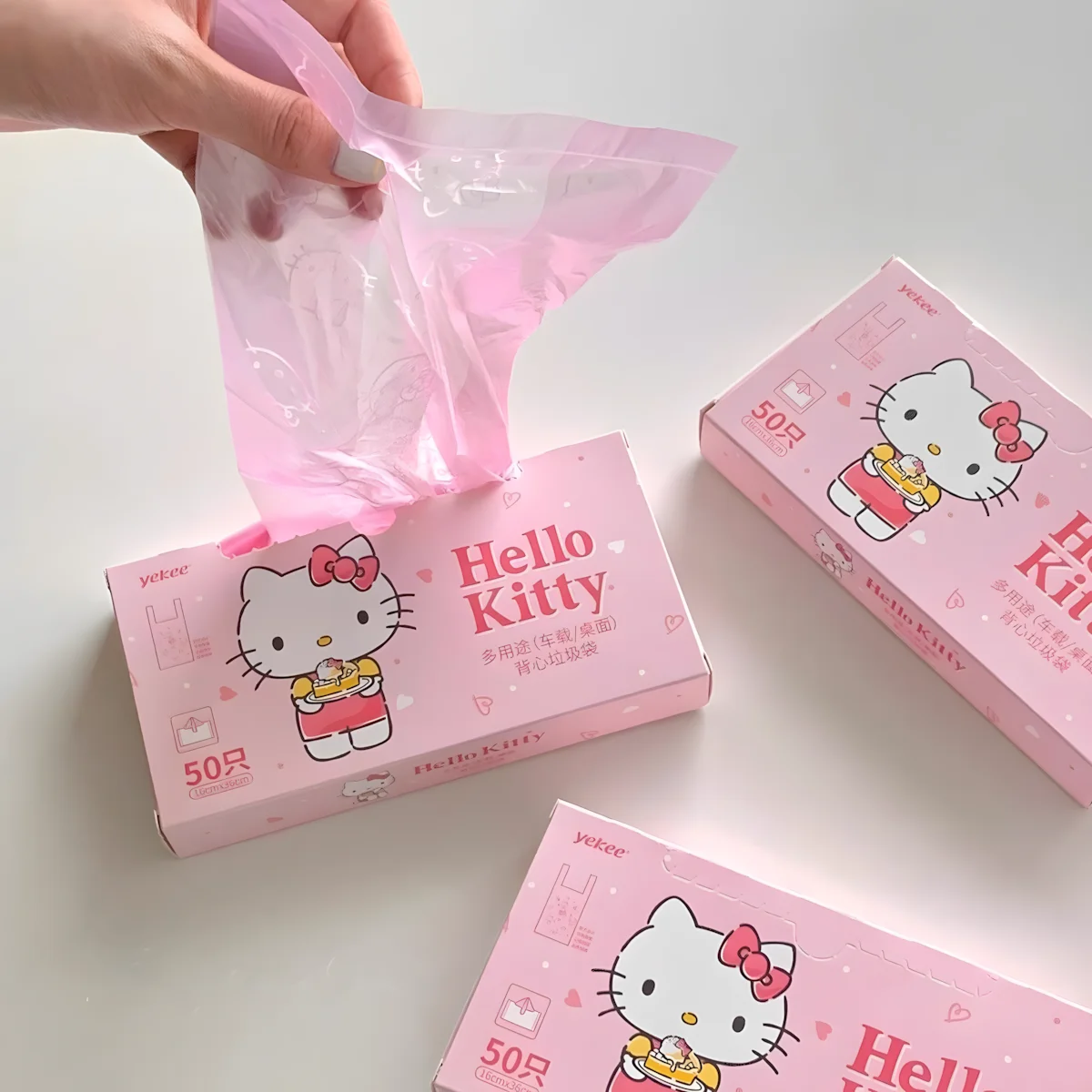 50pcs 귀여운 헬로 키티 일회용 쓰레기 봉투 자동차 데스크탑용 휴대용 핑크 조끼형 쓰레기 봉투
