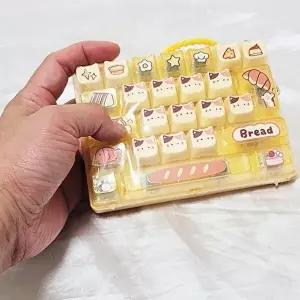 [셀러허브 패션]SA 옐로우 브레드 26구 투명 키보드 키캡키링 클리커 손장난감 뽑기방 백참 (52497881)