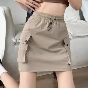 [라일리여성의류] Rly 카고 포켓 미니 스커트 밴딩 스트링 데일리 51694209)