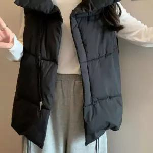 사선 지퍼 포인트 여성 밑단 스트링 루즈핏 조끼 패딩 점퍼 LE942F7