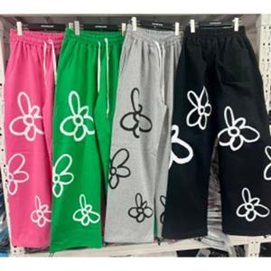 더블제이디 스프레이 플라워 트레이닝 팬츠 JGZK80910