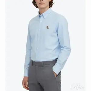 [메종키츠네]드레스드 폭스 패치 릴렉스드 남성 셔츠 라이트 블루 61697113