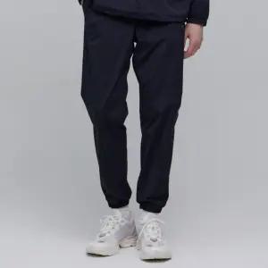 [내셔널지오그래픽]내셔널지오그래픽 N233MPT330 액티브 우븐 트레이닝 조거 팬츠 CARBON BLACK