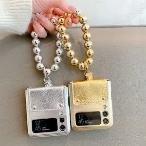 유니블링 갤럭시 z플립 3 4 골드 실버 힌지 구슬 스트랩 케이스