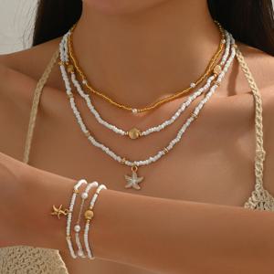 TEMU 6개 여름 해변 휴가 조개 및 펜던트 목걸이 및 팔찌 세트, 여성용 간편하고 우아한 디자인, 인조 진주 삽입 및 골드 비즈 포함, 레이어링에 적합. 이 여성용 주얼리 세트는 유리 재질입니다.