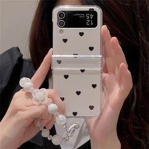 TEMU 휴대폰 케이스 - 고급스러운 레이저 비드 체인과 사랑스러운 하트 모양 접이식 디자인의 세련되고 귀여운 폰 케이스. 삼성 Z FLIP 7, 갤럭시 Z FLIP 6, Flip 5, Flip 4, 3, 그리고 5G용으로 디자인되었습니다. 간편하면서도 창의적인 보호 백 커버