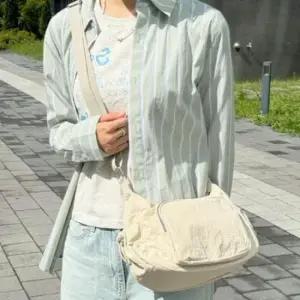 사이드포켓 앞지퍼 포인트 나일론 크로스백 패션