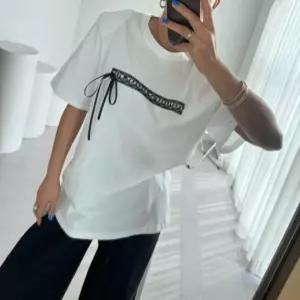 컬링 어깨패드 리본 레터링 반팔 티셔츠 루즈핏 유니크