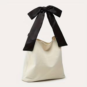 세련된 리본 장식이 돋보이는 여성용 토트백 - 탈부착 가능한 숄더 스트랩과 세련된 리본 장식이 돋보이는 넉넉한 디자인. 화이트 디자인은 캐주얼하고 업무 환경 모두에 적합합니다.