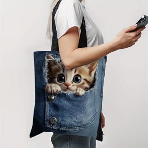이 1개 핸드백은 포켓에 앉아 있는 귀여운 작은 고양이 모양이 특징입니다. 이 귀여운 파란색 만화 쇼핑백은 쇼핑, 선물, 일상적인 사용에 완벽합니다.